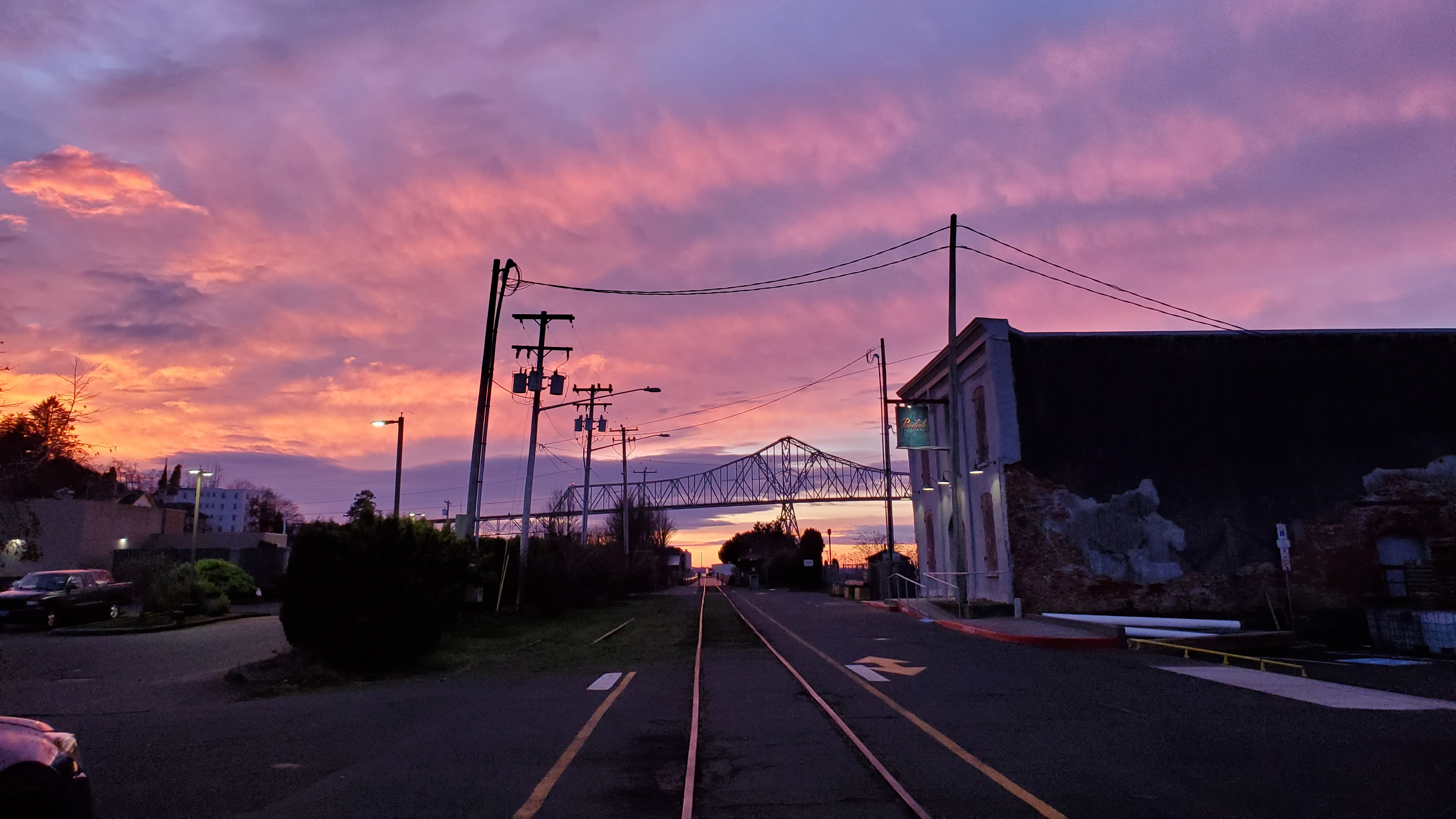 Astoria Megler Bridge at sunset with pink and purple sky